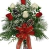 Red and white roses make a dashing holiday gift, especially when they