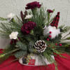 Mixed fragrant evergreens in a whimsical stone pot, enhanced with elegant burgundy
