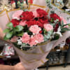 
A beautiful hand-wrapped bouquet featuring a romantic mix of red and pink
