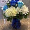 fresh white and blue flowers with hydrangeas daisies and blue roses 