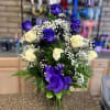 six purple /six white roses with greenery and baby breath