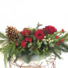 Your traditional centerpiece for the holidays with gorgeous reds and holiday foliage