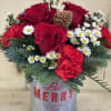 Deck the halls with this festive arrangement of rich red and winter