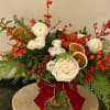 All of the seasonal elements are on display in this arrangement with