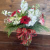 The quintessential Christmas bouquet has arrived. Rich ruby-red gerbera daisies and carnations