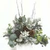 This artisan faux floral arrangement captures the essence of winter with beautifully