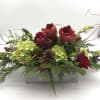 These elegant  stunning centerpiece is designed using Amaryllis, roses , green