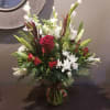 A fabulous, Christmassy addition to your home.

Arrangement measures: 28&quot;Tx20&quot;W and arrives in