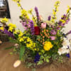Beautiful mixed spring bouquet presented in a basket is sure to bring