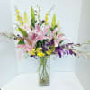 LILIES PAIRED WITH ORCHIDS MAKE A SPLENDID AND LONG LASTING BOUQUET.