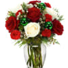 White roses, red roses, red mini carnations and white waxflower are complemented