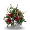 A classic holiday arrangement featuring rich red roses, fresh winter greens, pinecones