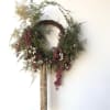 Dried floral wreath made with Plumosa Fern, Winged Everlasting, pink Peppercorns, and
