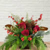 A classic red rose holiday themed low &amp; textured arrangement.