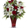 Red roses, white asiatic lilies and white button chrysanthemums are accented with
