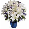 Beautiful blooms such as cr&egrave;me roses, white lilies and alstroemeria along with