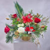 Holiday Orchid Elegance is a luxurious holiday arrangement featuring premium red roses