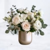 Porcelain Reverence is a study in understated luxury. Creamy white garden roses