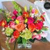 A bright and colorful, lushful arrangement designed in a high quality rectangular