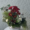Celebrate the season with our Christmas Ornament Floral Arrangement, a joyful blend