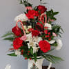 Beautiful roses, alstroemeria, carnations and other beautiful fill the pitcher to the