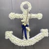 A white floral anchor created in white cushion chrysanthemums, white roses and