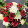 An elegant and enchanting arrangement featuring fresh roses accented with subtle glitter