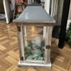 White Rustic Wood Lantern with gray ornate details around the top and