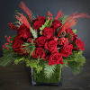 Red roses with red Christmas berries, greens, pinecones and jingle bells in