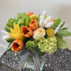 A lovely soft and gentle arrangement designed in a rectangular glass vase.