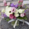 A Beautiful, soft design of stock, spray, roses, lisianthus , Gerbera daisies