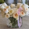 A stunning and luxurious arrangement of premium garden roses, featuring a soft