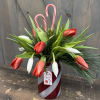 This festive arrangement does a great job of spreading the Christmas Cheer!