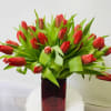 Clear glass vase with 20 red tulips, but you can request any