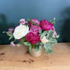 A lush, romantic arrangement featuring rich raspberry and soft blush blooms, thoughtfully