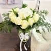   Imagine a bouquet where purity and elegance intertwine. At the