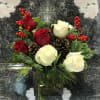 Festive Christmas Greens Designed in a contemporary cube vase with Red and