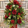 This Regal Holiday Tree is crafted with fresh evergreens, rich red roses