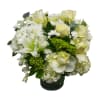 A soft, timeless mix of white roses, lilies, hydrangea, and lush greenery