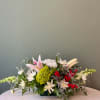 Beautiful holiday centerpiece in red, white, pink, and green.
Featuring:
- Stargazer Lilies
- Green
