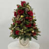 Full of shades of red, green and gold, this fresh miniature Christmas