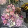 This is a beautiful and very sweet floral arrangement. It features a