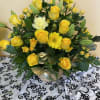 A MIXTURE OF YELLOW FLOWERS WITH A TOUCH OF GOLD RUSCUS IN