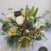 Elegant, natural-style winter arrangement designed in a wooden basket made with&nbsp;whites, creams