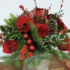 An elegant yet simple floral arrangement to compliment your Christmas decor. Roses