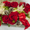 Long and low centerpiece with assortment of red roses, white hydrangeas, white