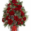 Teleflora's Yuletide Sparkle Tree is a festive floral Christmas tree made of