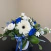 Beautiful vase of blue and white flowers 