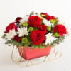 EXCLUSIVE Send holiday joy their way! Our dashing arrangement features classic Christmas-colored