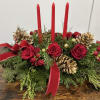 Beautiful Christmas inspired centerpiece filled with seasonal greenery and flowers. 